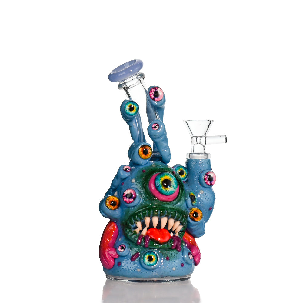 Croia Glass 8" Multi-Eye Monster clay art water pipe with intricate design and colorful accents.