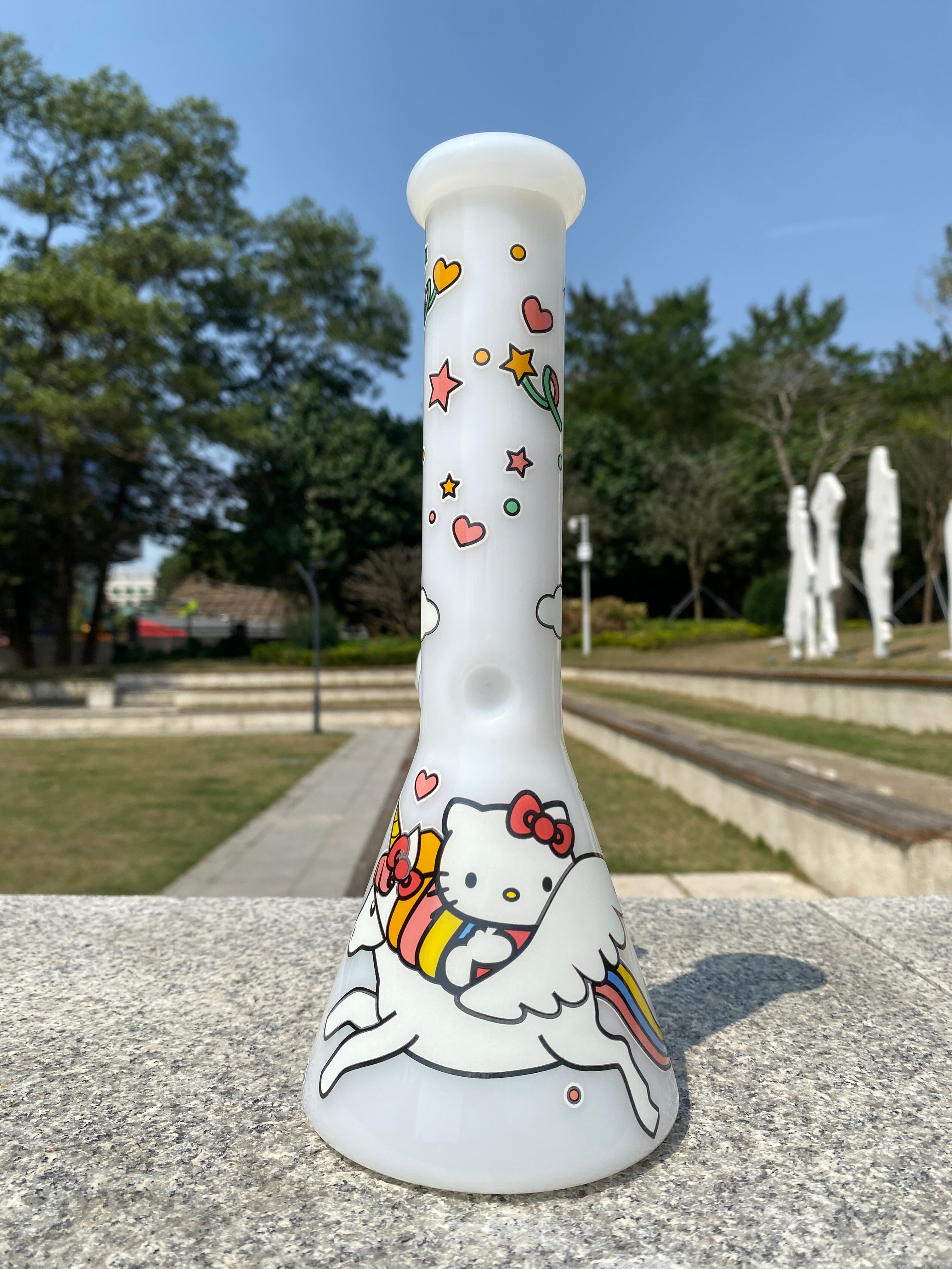 Unique white beaker bong by Croia Glass featuring a cute Hello Kitty design, perfect for collectors and enthusiasts.