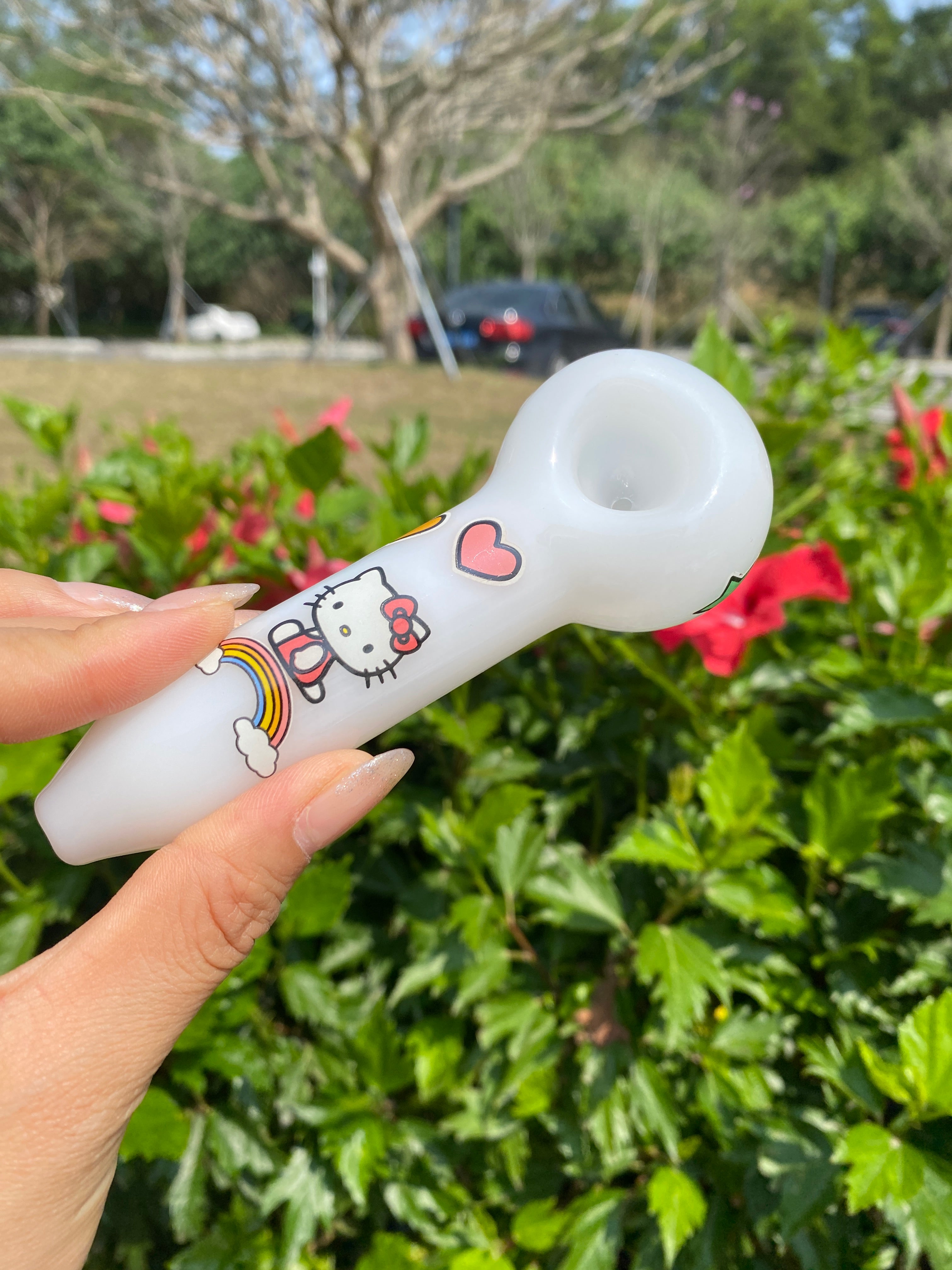 Unique white beaker bong by Croia Glass with a cute design and smooth curves, set against a neutral background.